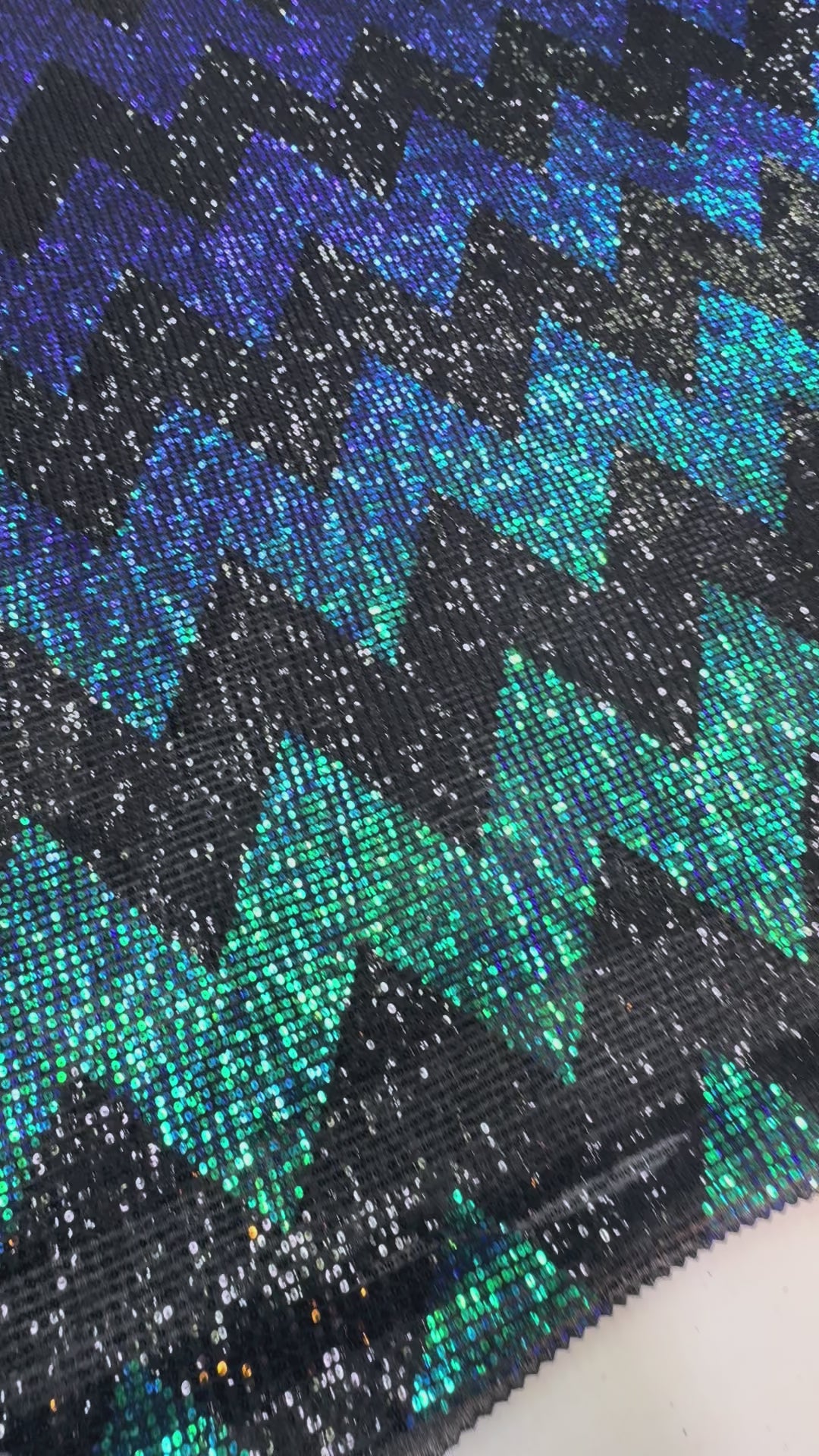 Blue-Green Iridescent Chevron Sequin Fabric on Black Mesh